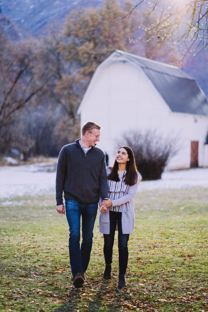 Couple walking in front of Jolley's Ranch barn